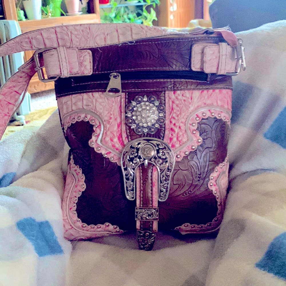 Crossbody-Concealed Weapon pocket. Used well but has many more miles to go!